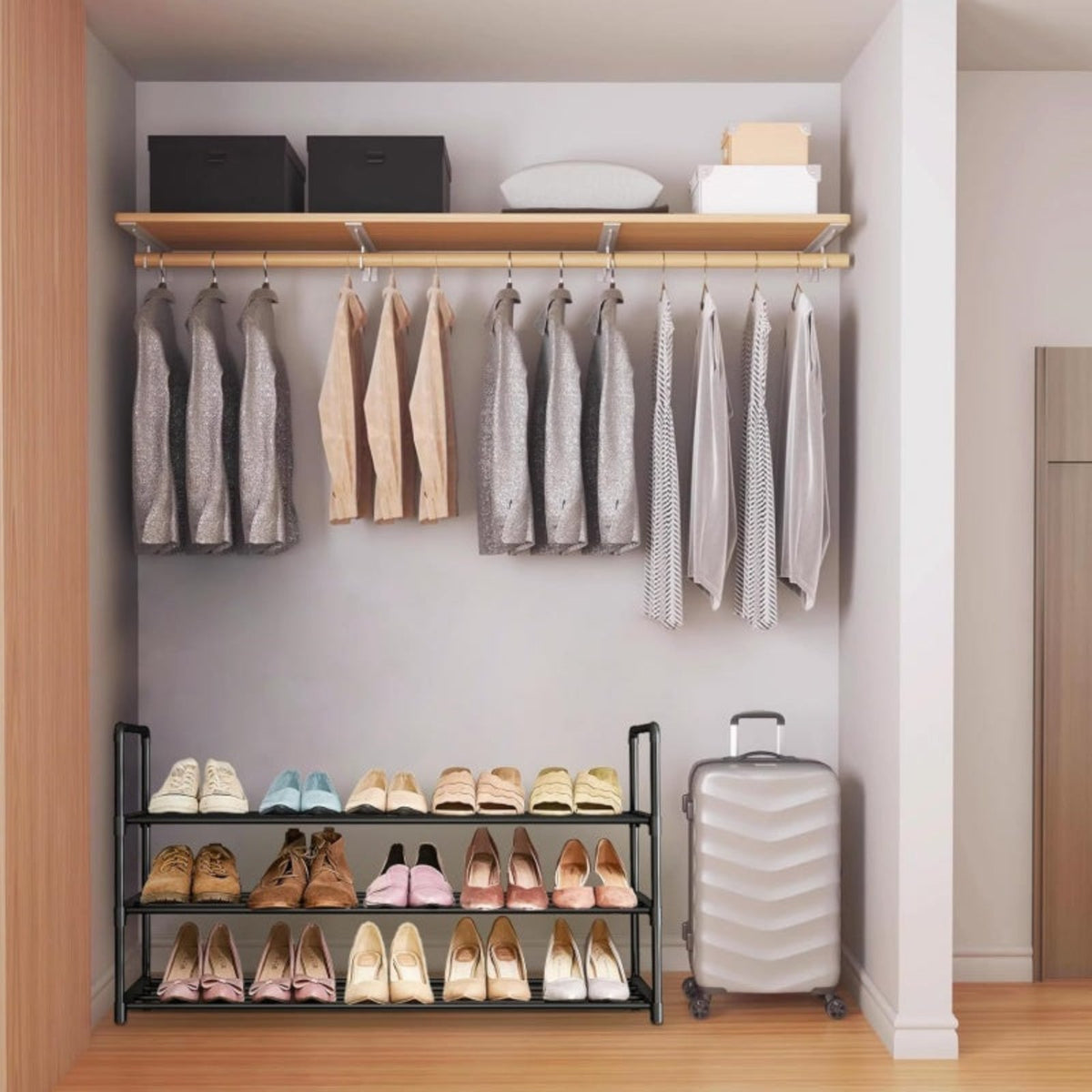 Fully loaded shoe rack fitted neatly inside a wardrobe closet beneath hanging clothes