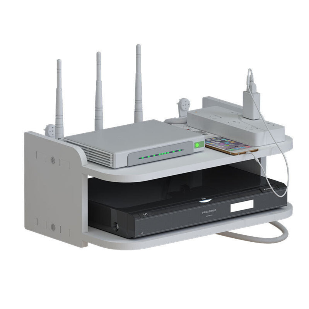 A white multi-port router and power strip shelf organizer holding a router with four antennas, a power strip, a smartphone, and a black DVD player, shown on a white background.