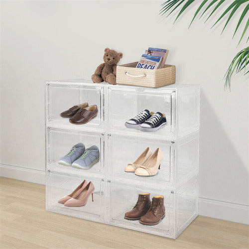 Stacked clear shoe storage boxes displaying trainers, heels and boots