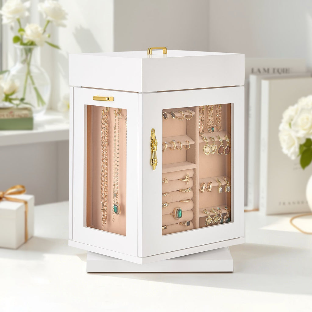 White jewelry organizer with gold accents on a white surface, surrounded by flowers and a gift box.