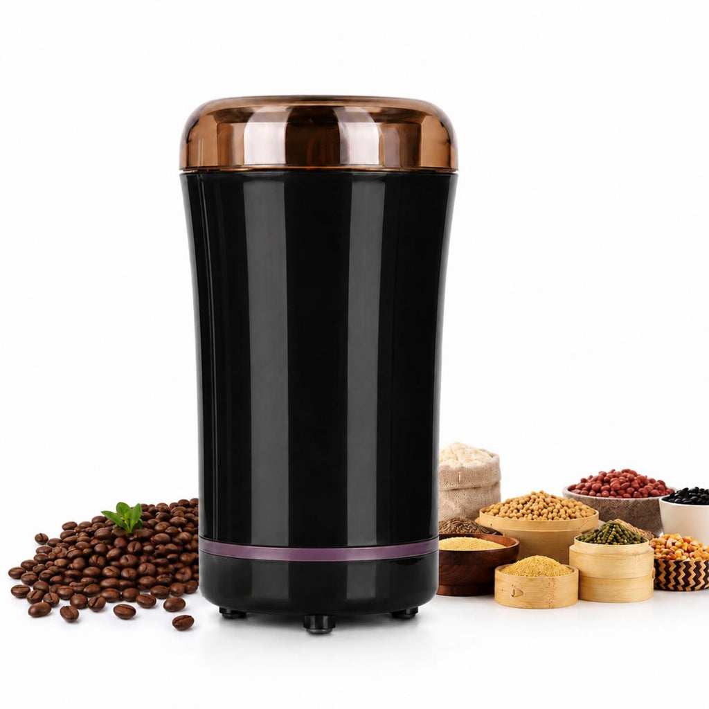 A black electric coffee grinder with a metallic copper lid, shown on a white background with coffee beans and various grains on the left and right.