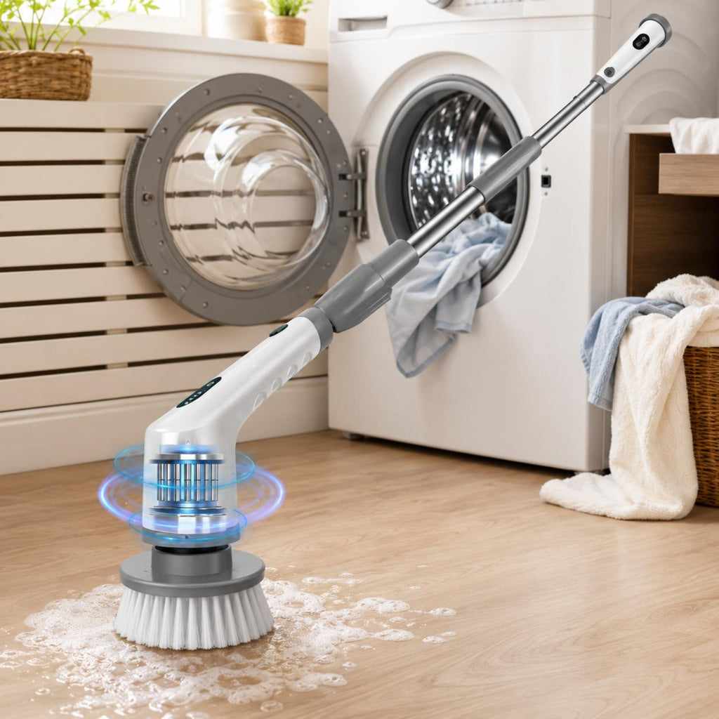 A cordless floor scrubber with a white and gray handle and a blue-lit rotating brush head is shown cleaning a light wood floor in a laundry room, with a washing machine and laundry visible in the background.